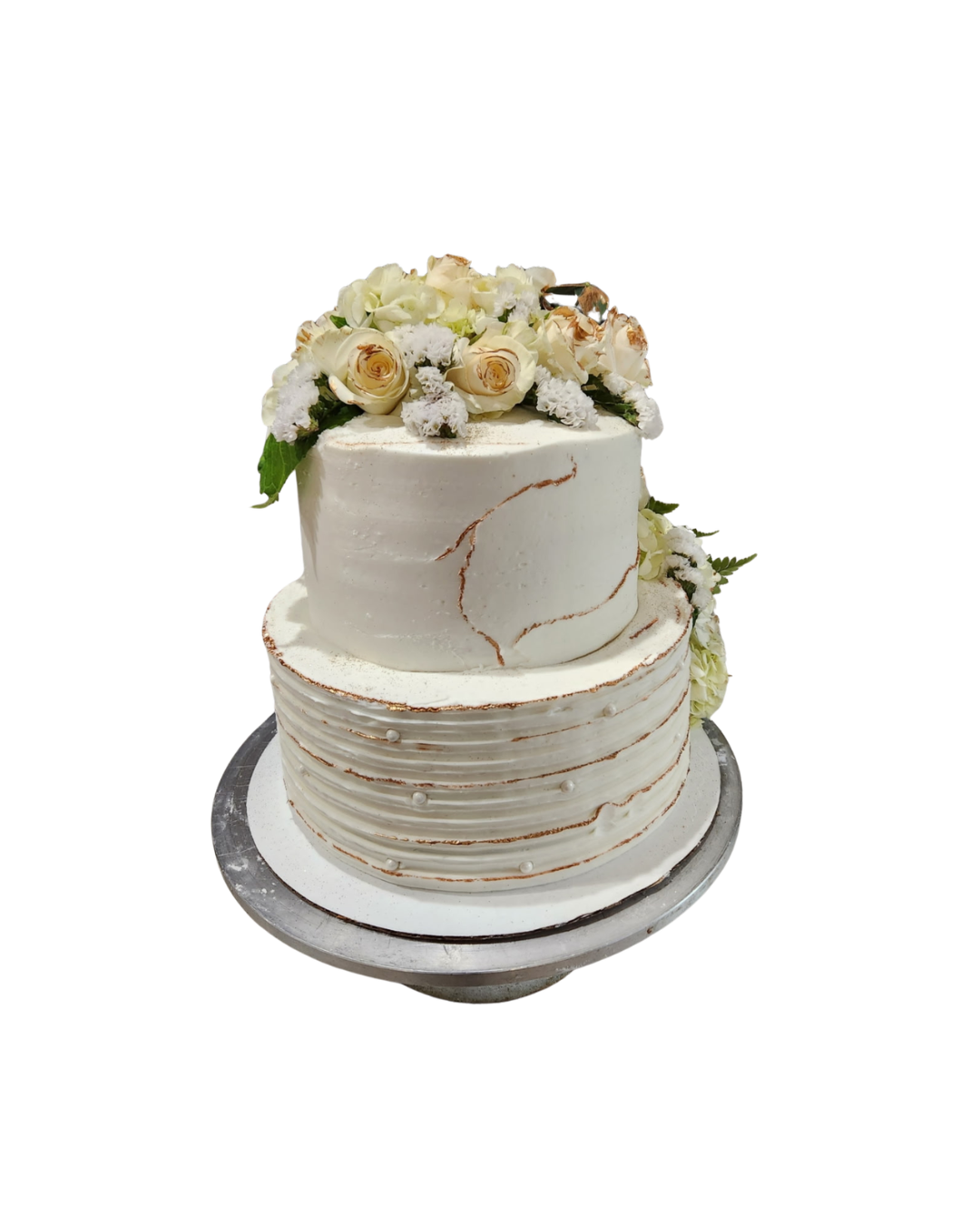 Two-tier white cake with rose gold accents and cream florals